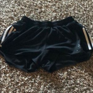 Black adidas pants with 3 stripes